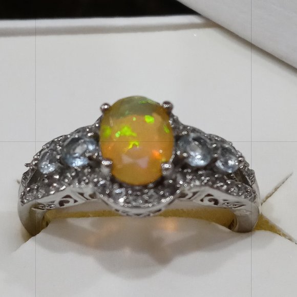 3.2 cttw Ethiopian Opal & Swiss Blue Topaz w/ White Topaz Ring